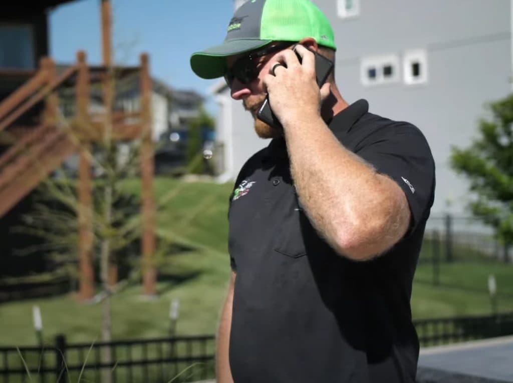 Landscape contractor on phone